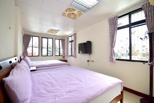 Ένα ή περισσότερα κρεβάτια σε δωμάτιο στο Dongjin B&B