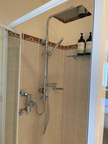 a shower in a bathroom with a glass door at Nora's Place - Explore Mudgee's Best Wineries in Mudgee
