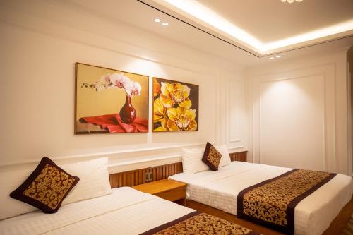 Postel nebo postele na pokoji v ubytování La Fleur Premium Central Apartment Hotel
