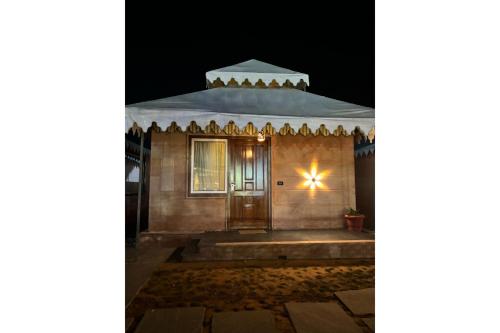 a small building with a door at night at The Grand Shekhawati in Rāmsir