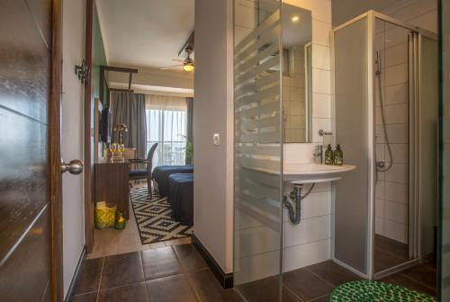 a bathroom with a shower and a sink in a room at Anjeliq House Boutique Hotel in Alanya