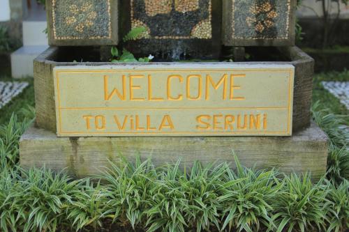 a welcome to villa sernin sign in a garden at Villa Seruni Lovina in Lovina