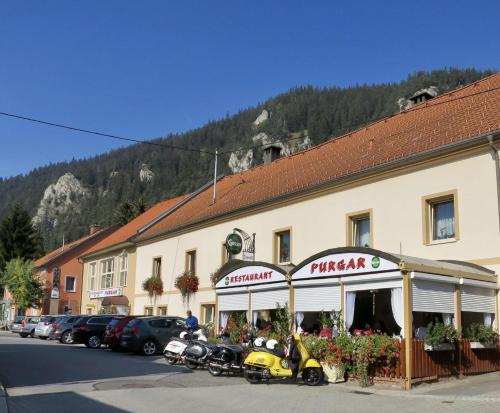a building with motorcycles parked in front of it at Ferienhaus Purgar in Kammern im Liesingtal