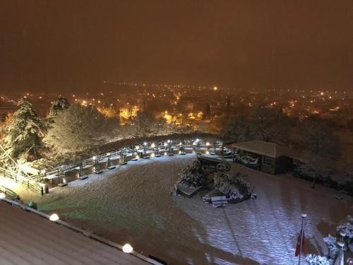 a night view of a park with snow on the ground at Kazdağ Göknar Otel in Yenice