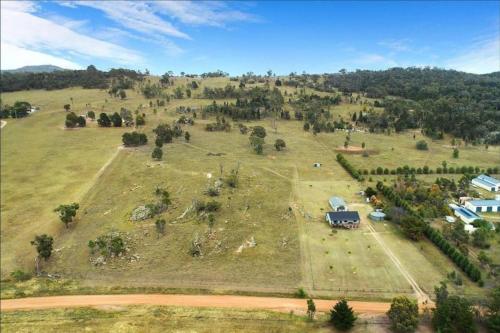 an aerial view of a large field with a house on it at Private Rural Solace at Saje Farm in Cooks Gap in Mudgee