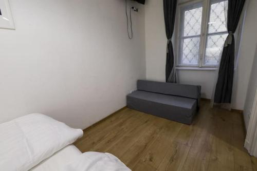 Ένα ή περισσότερα κρεβάτια σε δωμάτιο στο Pest-port Private apartment Room-6