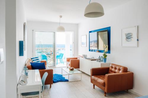 a living room with a couch and chairs at Zima Blue in Zygi