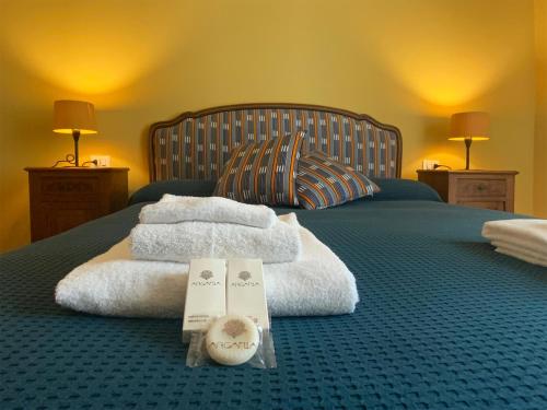 En eller flere senge i et værelse på Casa Lodovica