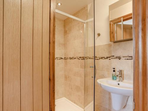 a bathroom with a shower and a sink at 1 bed in Wedmore 51338 in Chapel Allerton