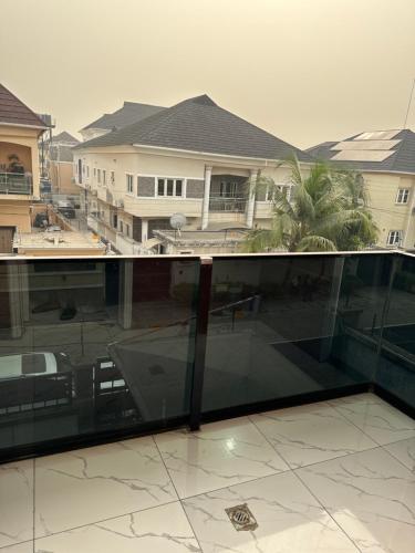 a view from the balcony of a house at Affordable luxury 3bed apartment in Maiyegun