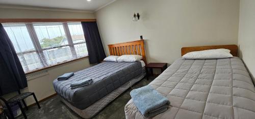 Katil atau katil-katil dalam bilik di Whitehorse Inn