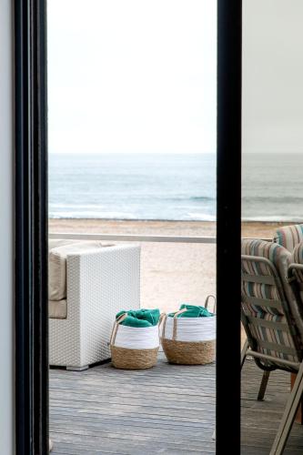 a living room with a view of the beach at Flamingo Beach in Swakopmund
