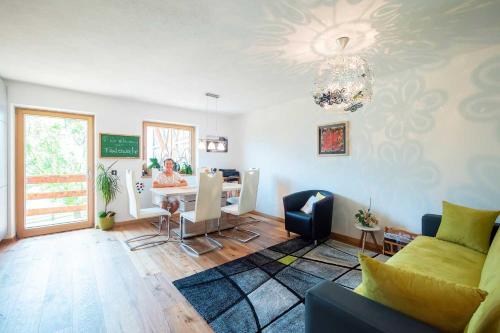 a living room with a couch and a table at Oberpiskoihof in Funes