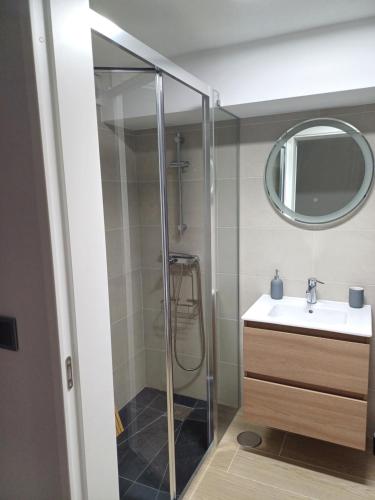 a bathroom with a shower and a sink at Casa da Póvoa in Seia
