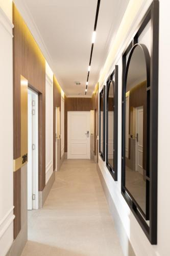 a hallway in a building with mirrors on the walls at RIVA sleep & chill in Valjevo
