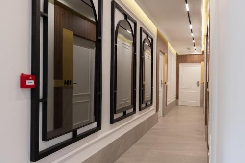 a hallway with a row of windows on the wall at RIVA sleep & chill in Valjevo