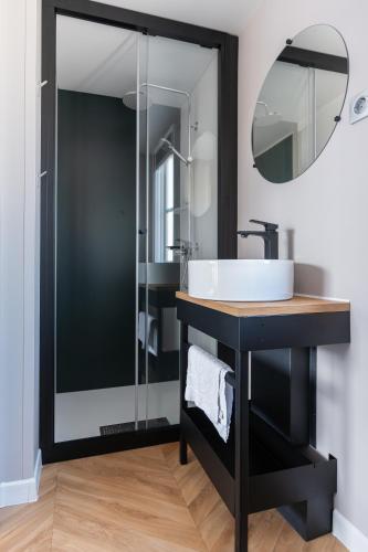 a bathroom with a sink and a mirror at Club del Sole Tenuta Primero Grado Family Collection in Grado