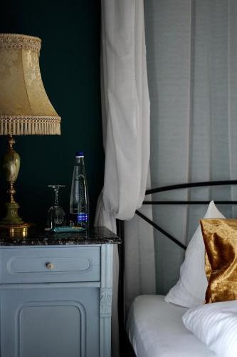 Postel nebo postele na pokoji v ubytování Hotel Mühldorf