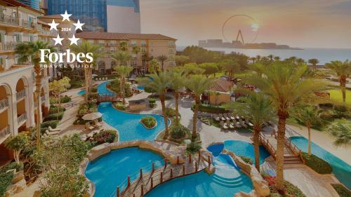 an aerial view of a water park at a resort at The Ritz-Carlton, Dubai in Dubai
