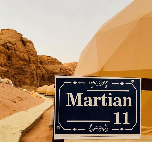 a sign in the middle of a desert at Hasan Zawaideh luxury camp 2 in Wadi Rum