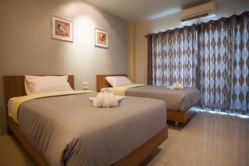 Una cama o camas en una habitación de Morage Hotel