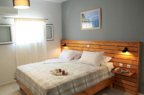 a bedroom with a large bed with a plate on it at Ionian Balcony in Athanion