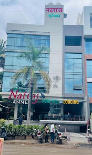 a palm tree in front of a building at Natraj Annex , Sangli in Sangli
