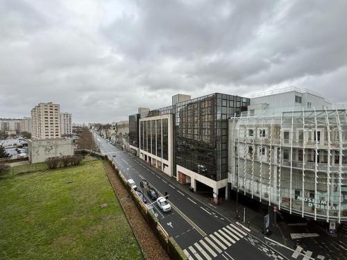 an overhead view of a city street with buildings at T3 pied de la gare + centre commercial TOUT inclus in Orléans