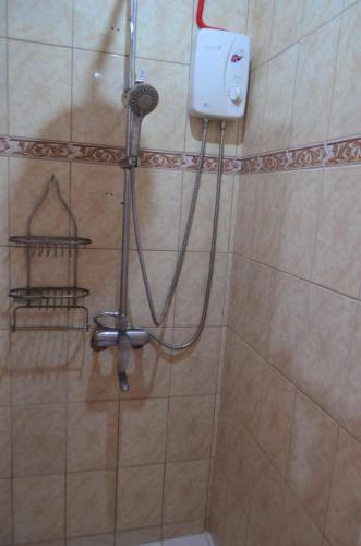 a shower in a bathroom with a shower at Private beachfront house with ocean view and direct reef access in Moalboal