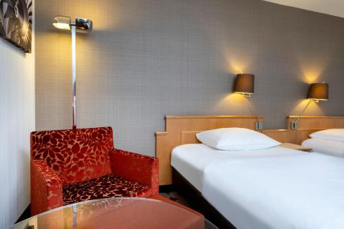 Un ou plusieurs lits dans un hébergement de l'établissement Mövenpick Hotel Nürnberg Airport