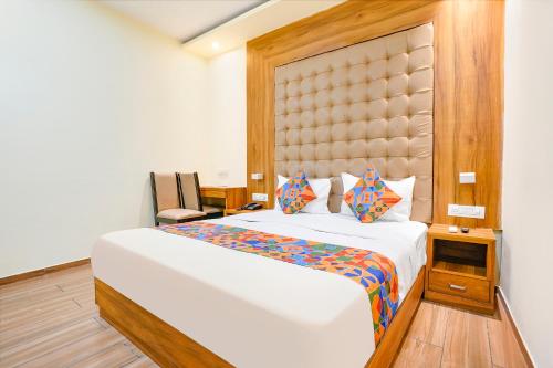 a bedroom with a large bed in a room at FabHotel Cozy Inn in Mumbai