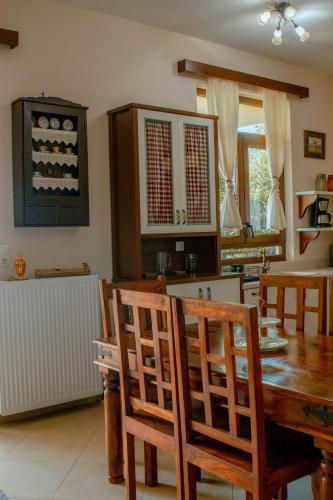 a kitchen and dining room with a table and chairs at Villa Kalamitsi Luxury Villa in Apokorona Chania in Kariá