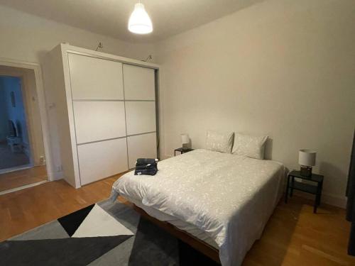 a bedroom with a large bed with a large closet at Luxury Apartment In City Centre in Gothenburg