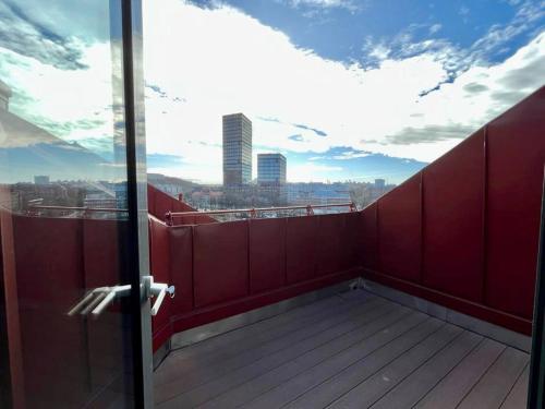 a balcony with a view of a city at Cozy Private Terrace Flat In Central Gothenburg in Gothenburg