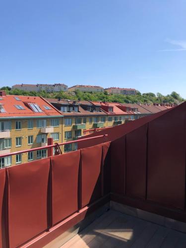 a view from the balcony of a building with roofs at Cozy Private Terrace Flat In Central Gothenburg in Gothenburg