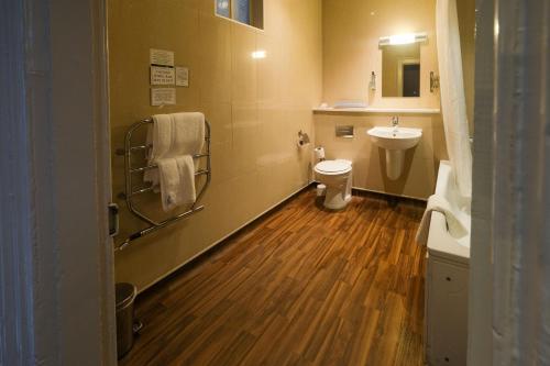 a small bathroom with a toilet and a sink at The Unicorn Hotel Wetherspoon in Ripon