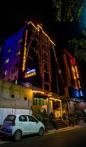 a car parked in front of a building at night at Florence Continental Udaipur in Udaipur