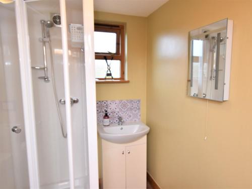 a bathroom with a sink and a shower at 2 Bed in Ledbury 77377 