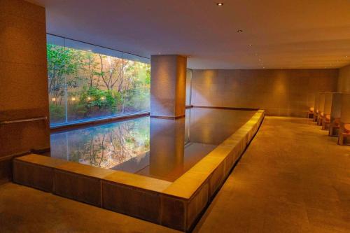 a large aquarium in a room with a large window at Hyatt Regency Hakone Resort and Spa in Hakone