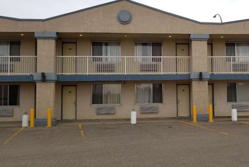 a large building with balconies on the side of it at Days Inn by Wyndham Swift Current in Swift Current