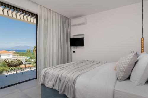 Postel nebo postele na pokoji v ubytování AKEA VILLAS
