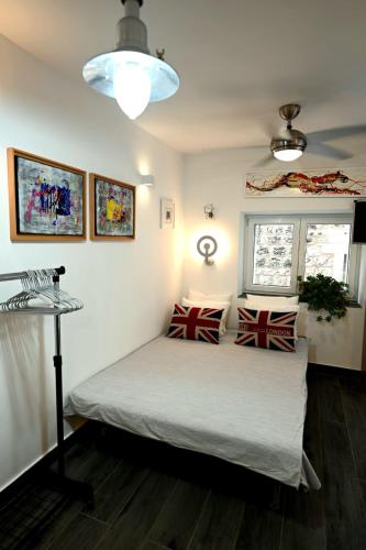 a bedroom with a bed with pillows on it at Bel-Art in Hvar
