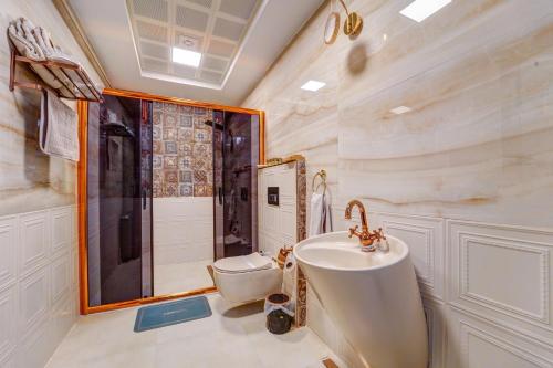 a bathroom with a sink and a toilet at Kerem ile Aslı Butik Hotel in Melikgazi