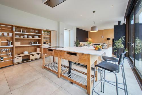 a kitchen with a large island in a room at Host & Stay - Sleeper Cottage in Brompton