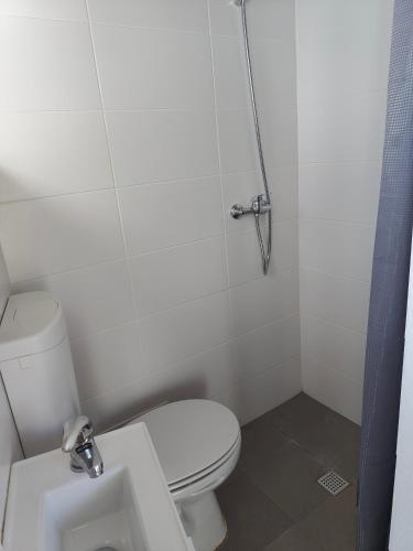 a small bathroom with a toilet and a sink at Quinta da Eira Silves in Silves