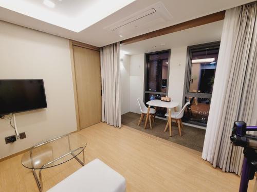 A television and/or entertainment centre at Best Travel in Haeundae with best location
