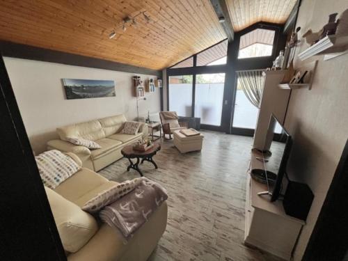 Posezení v ubytování Ferienhaus Objekt Nr 1116 in Fedderwardersiel