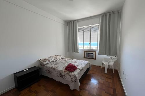 Ein Bett oder Betten in einem Zimmer der Unterkunft Rainha Praia do Leme