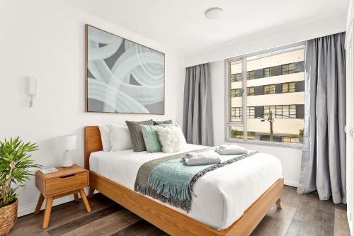 En eller flere senge i et værelse på Waterfront Delight on Darling Harbour at Pyrmont