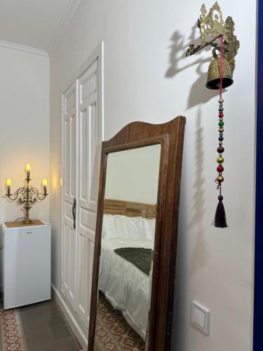 a mirror in a room next to a bedroom at Castaños 4 in Alicante